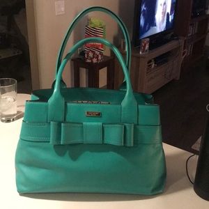 kate spade teal bow purse with dust cover.